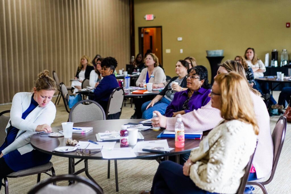 Group of women sitting at a table during a SBDC Women's Workshop.